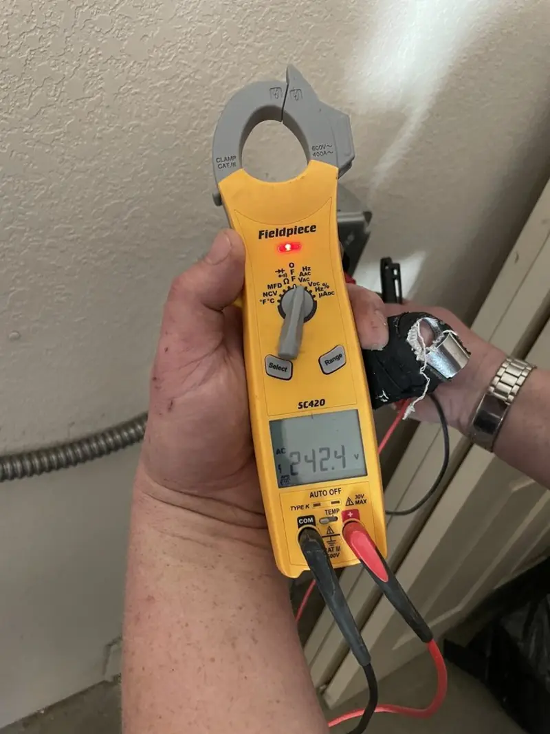 Voltage testing with clamp meter during Electrical Installation Services in Longview Heights